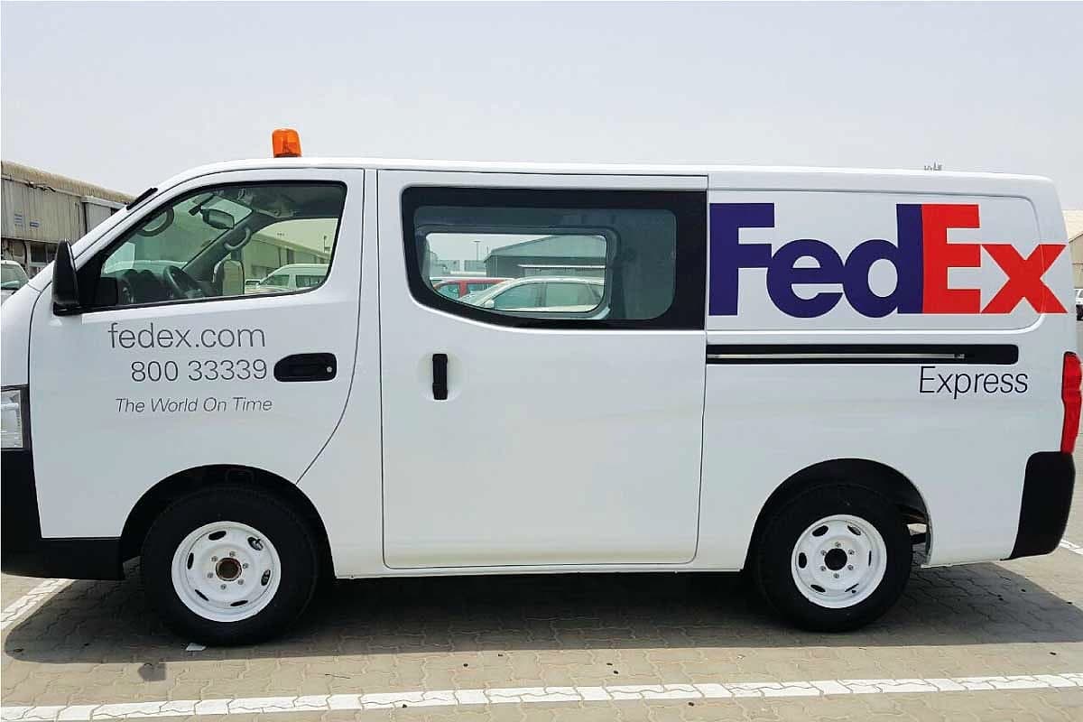 FedEx Express van with printed side livery parked at a kerb