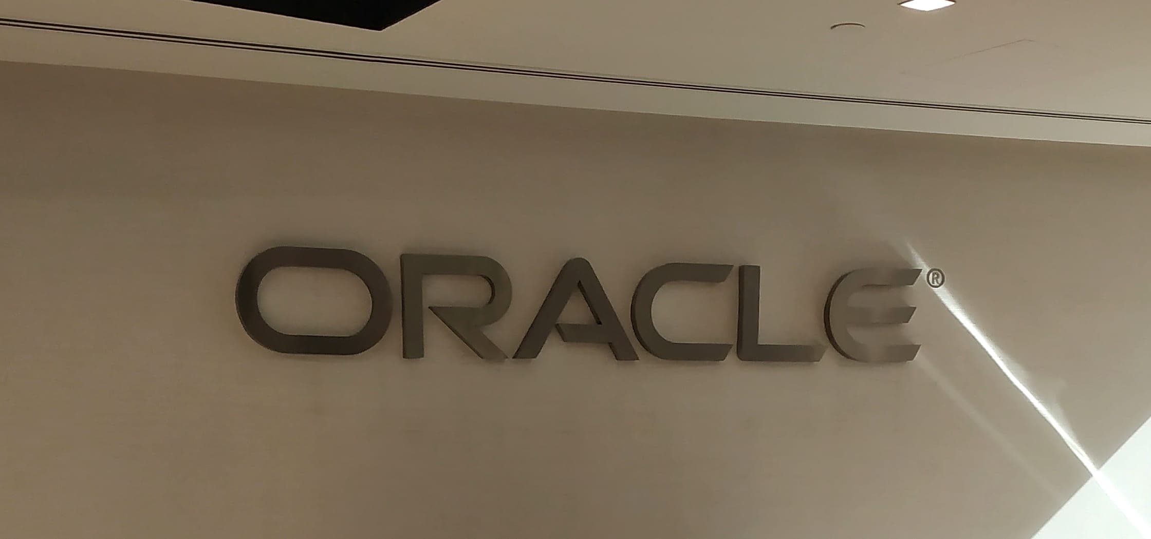 3D Oracle letters on a sunlit reception wall