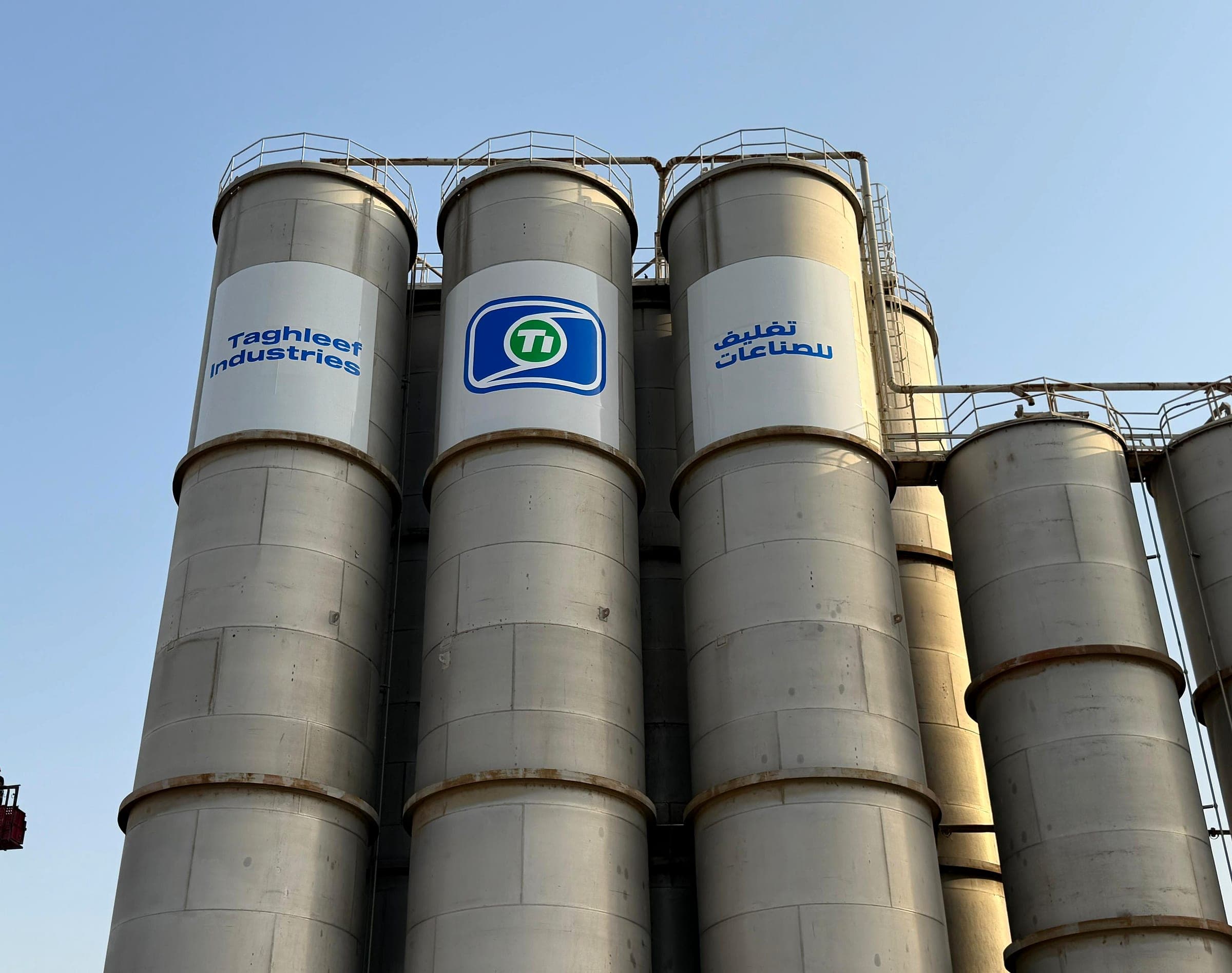 Large-format Taghleef Industries graphics on tall steel silos