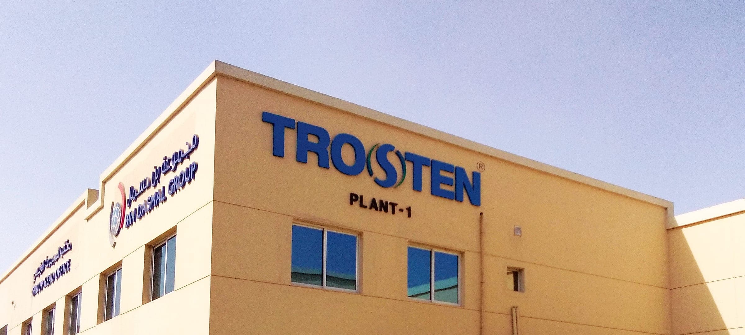 Blue channel letters on the Trosten factory building
